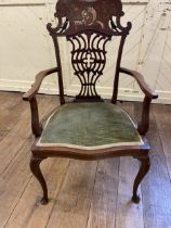 An early 20th century inlaid mahogany armchair