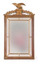 A 19th century style carved wood and gilt gesso mirror, with an eagle finial, 126 x 170 cm