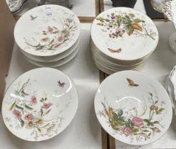 An early 20th century Limoges part dessert service, decorated insects and flowers, comprising five