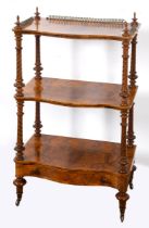 A late Victorian walnut three tier whatnot, 61 cm wide