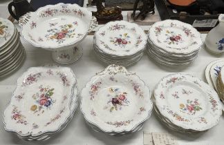 An early 20th century Staffordshire part service, comprising a comport, seven dishes and twenty