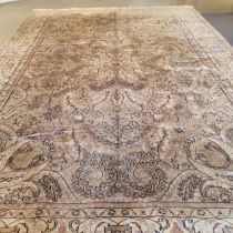 A Kashmiri silk cream ground carpet, 272 x 180 cm Loss of colour, general wear