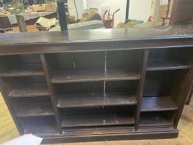 An oak bookcase, with adjustable shelves, 185 cm wide