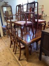 A mahogany extending draw leaf dining table, the top 153 x 122 cm, a set of seven Queen Anne style