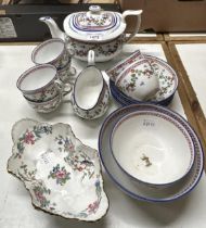 A late 19th century Staffordshire tea set, decorated flowers, comprising a teapot, sugar bowl, cream