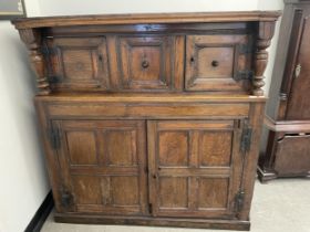 An oak court cupboard, with panel doors, 143 cm wide