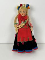 A mid-20th century Continental felt doll, in traditional dress, probably be Lenci, boxed Box in poor