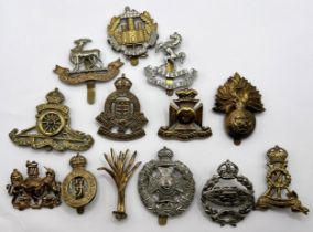 Assorted regimental cap badges, and other items