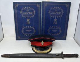 A 1907 pattern bayonet, with a scabbard, a REME officers peaked cap, and two copies of The