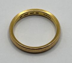 A 22ct gold band, ring size L, 4 g