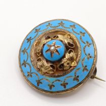 A Victorian yellow coloured metal and blue enamel target memorial brooch