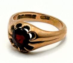 A 9ct gold and garnet ring, ring size L All in 4.5 g