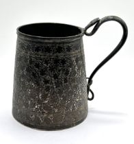 An Indian silver coloured metal mug, with a serpent handle
