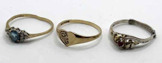 A 9ct gold signet ring, ring size P, 1.2 g, a white and blue stone ring, and a silver ring (3)