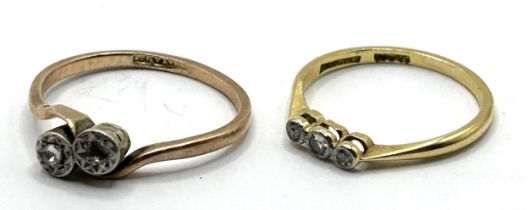 A 9ct gold and three stone diamond ring, ring size M, and a 9ct gold and diamond ring, lacking one