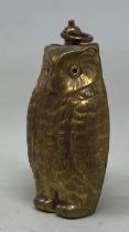 A novelty brass sovereign holder, in the form of an owl Condition good, a 20th/21st century copy