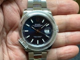 A gentleman's Rolex Oyster Perpetual DateJust 41 steel blue baton dial wristwatch, with a steel
