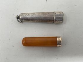 A 9ct gold and amber cheroot, in a silver holder, and a 9ct gold and amber cheroot (2)