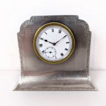 A George V silver cased mantel clock, with engine turned decoration, Birmingham 1921