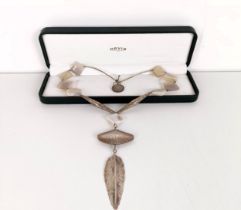 A silver coloured metal and hard stone necklace, in an Orvis box