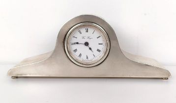 A modern silver cased mantel clock, 17 cm wide