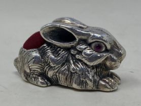 A novelty silver pin cushion, in the form of a rabbit Condition good, a 20th/21st century copy