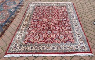 A hand-made Kashan rug, 203 x 140 cm