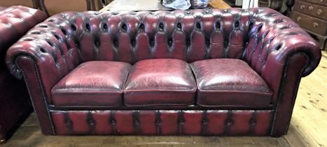 A Chesterfield style red leather sofa, 180 cm wide