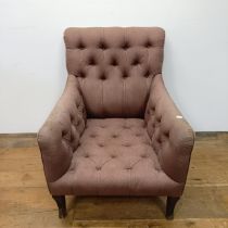 An early 20th century button back library armchair