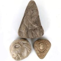 A carved stone, of triangular form, decorated a figure, 22 cm high, and two other stone carvings (3)