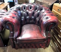 A Chesterfield style red leather armchair