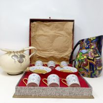 A set of six Limoges coffee cans and saucers, cased, and two jugs (3)