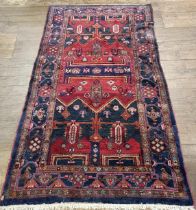 A Turkey style red ground rug, 153 cm wide some splits/damage