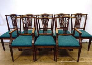 A set of eight camphorwood dining chairs, with pierced splat backs and padded seats (6+2)