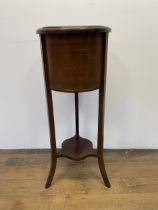 A mahogany jardinière stand, with a brass liner, 94 cm high