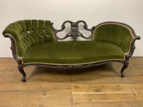 A late 19th century carved mahogany scroll end settee, decorated foliate forms, on cabriole legs,