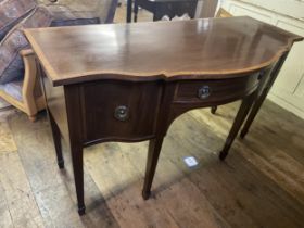 A mahogany and satinwood crossbanded serpentine front sideboard, 161 cm wide