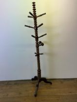 An unusual turned mahogany coat/hat stand, 187 cm high