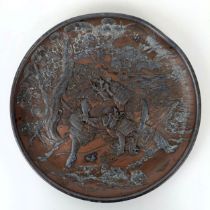 A Japanese gilt metal dish, decorated fighting warriors, 25 cm diameter