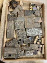 A large quantity of vintage printing letter and image blocks, in thirteen trays