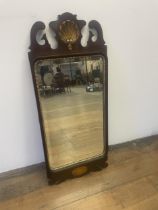 A George III style mahogany fret mirror, with a shell finial, 92 x 40 cm