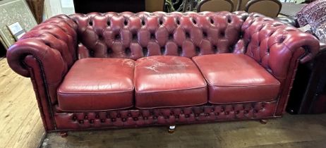 A Chesterfield style red leather sofa, 213 cm wide