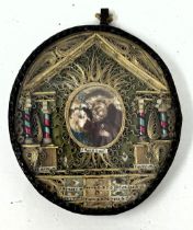 An icon, in an oval glazed case, 12 x 10 cm