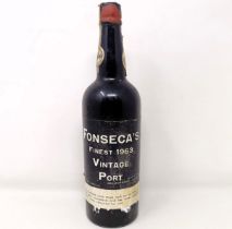 A bottle of Fonseca's 1963 vintage port capsule incomplete, level to bottom of neck, cellaring not