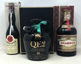 A bottle of QEII whisky, a bottle of Drambuie and another bottle, all boxed (3)