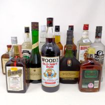 A litre bottle of Beefeater London Gin, a litre bottle of Woods Old Navy Rum, and assorted other
