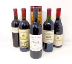 A bottle of Barolo, 2003, a bottle of Chateau Puyblanquet Charrille, 1995, three other bottles of
