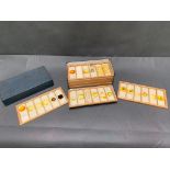 A box of vintage scientific slides containting embryos of mice etc