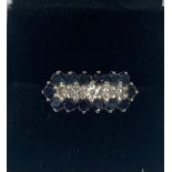 An 18 ct gold and 14 sapphire ring with 5 diamonds in very good condition Size N.5 4.8 Grams