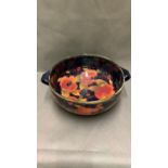 A vintage Moorcroft bowl 26 cm diameter, peaches and grapes pattern, hand signed